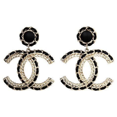 huge rectangular earrings with chanel spelled out in diamonds|Earrings in gold and diamond .